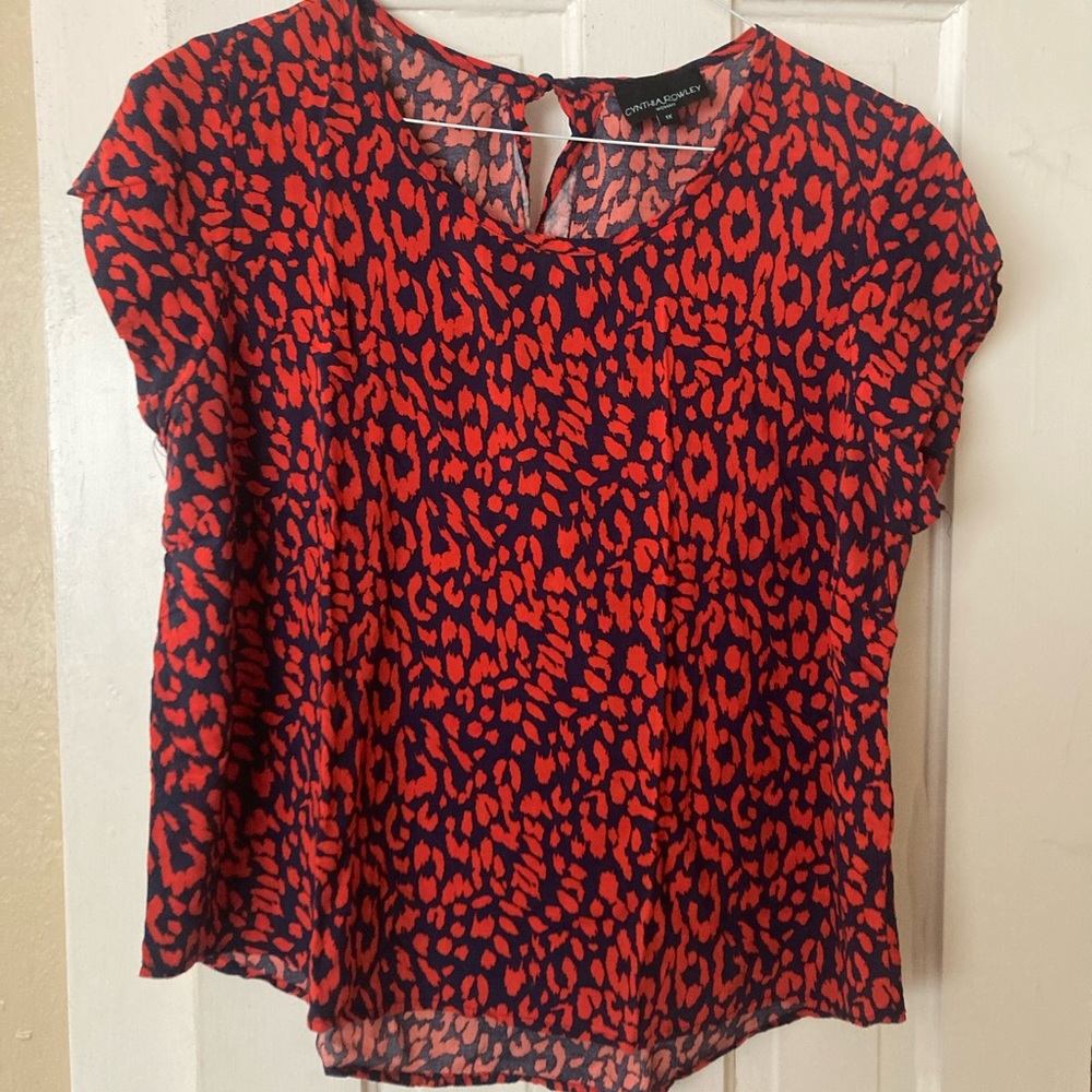 Short sleeve blouse with red pattern.  Size 1X